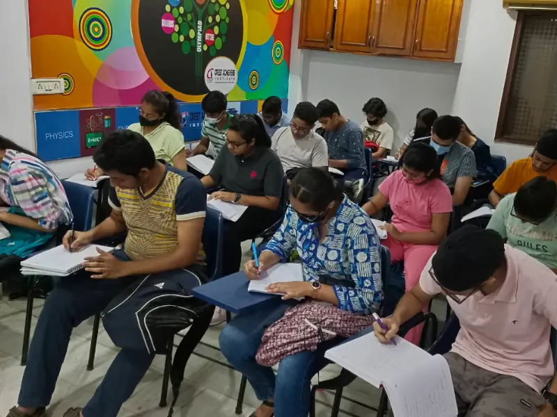Students writing test in classroom during regular assessment session